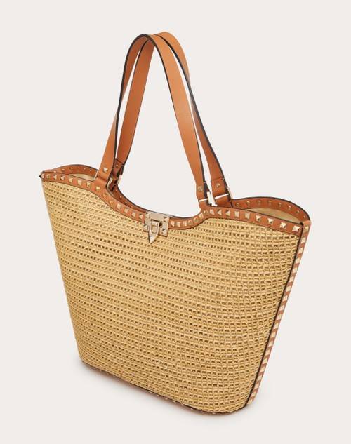 Red Valentino BORSA SHOPPING ROCKSTUD IN RAFIA INTRECCIATA 2025
